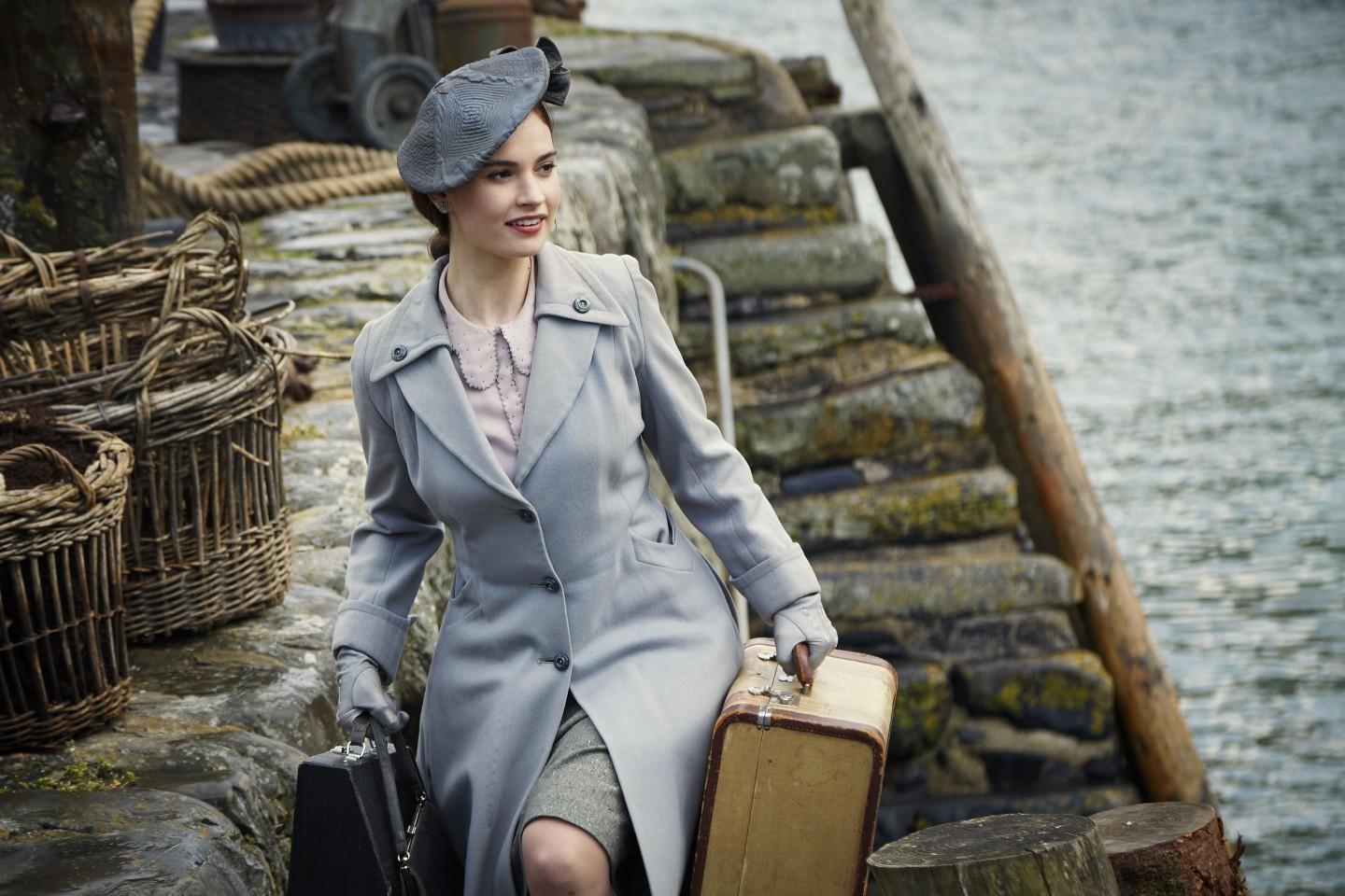The Guernsey Literary and Potato Peel Pie Society film still - Lily James playing Juliet Ashton (02) © STUDIOCANAL S.A.S